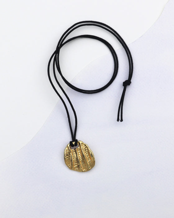 Fossil Pendant on Cotton Cord