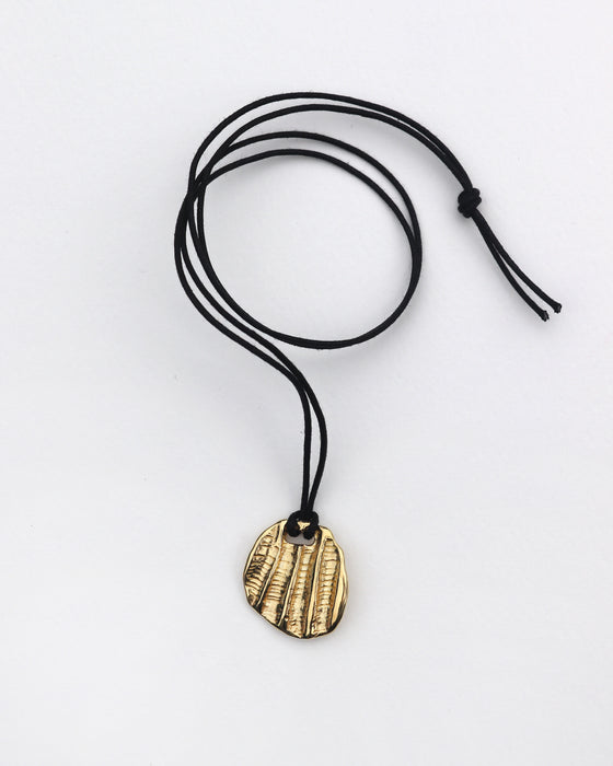 Fossil Pendant on Cotton Cord