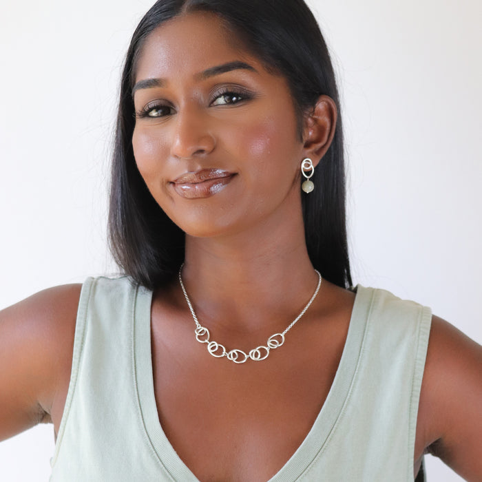 silver halo earrings and sunlight necklace